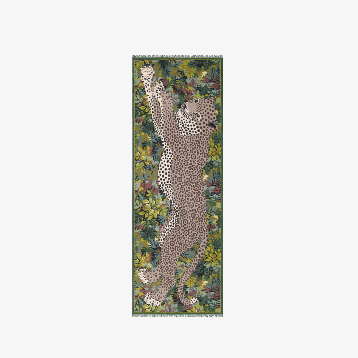 A long rectangular woven textile with fringe at both ends, featuring a leopard surrounded by dense tropical foliage in green, olive, brown, and beige tones. The textile is centered on a plain light gray background.