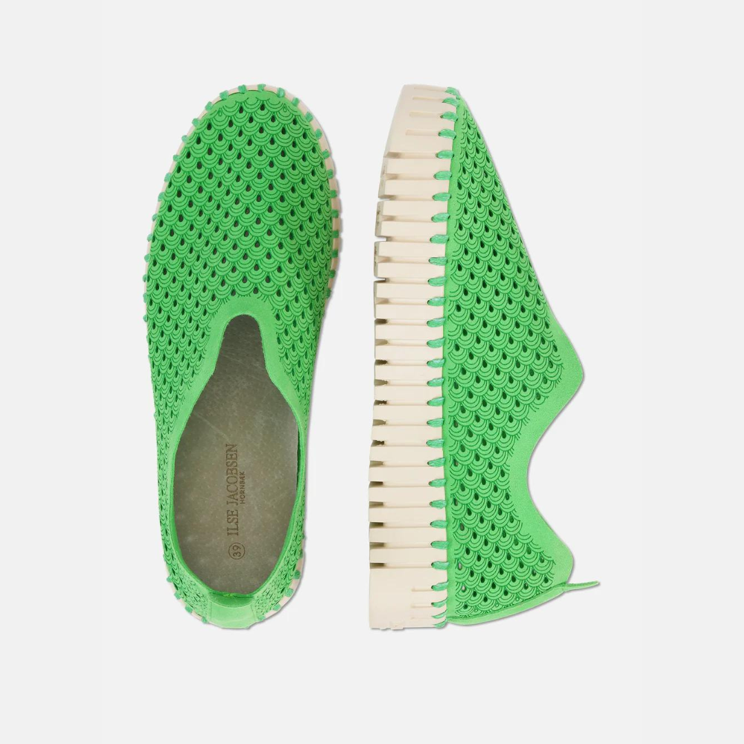 Pair of Ilse Jacobsen Hornbæk bright green slip-on shoes with textured, patterned uppers and cream-colored, ridged soles.