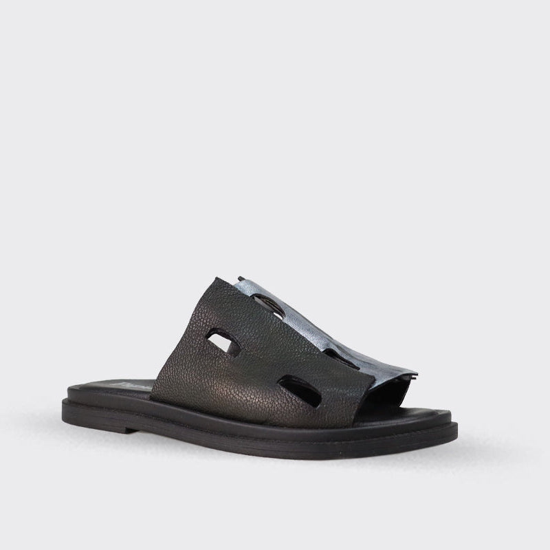 Black leather slide sandal with cut-out detailing and silver accents.  The sole is flat and black.