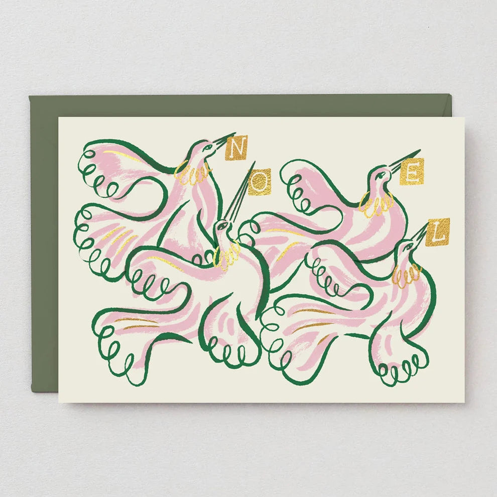 A greeting card with an illustrated design of pink birds outlined in green, with the word 'NOEL' in gold letters, shown with a dark green envelope against a light gray background.