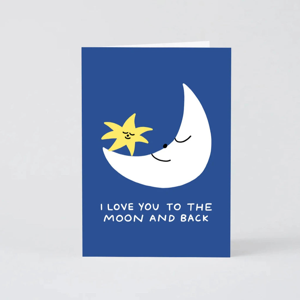 Greeting card featuring a crescent moon and star with faces, on a blue background.