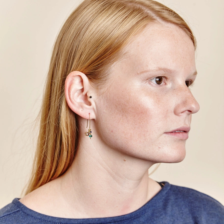 Gold drop earrings featuring small, multicolored gemstones.