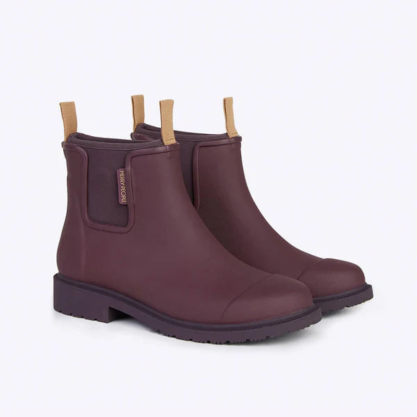 Pair of burgundy rubber ankle boots with a low block heel and tan pull tabs.