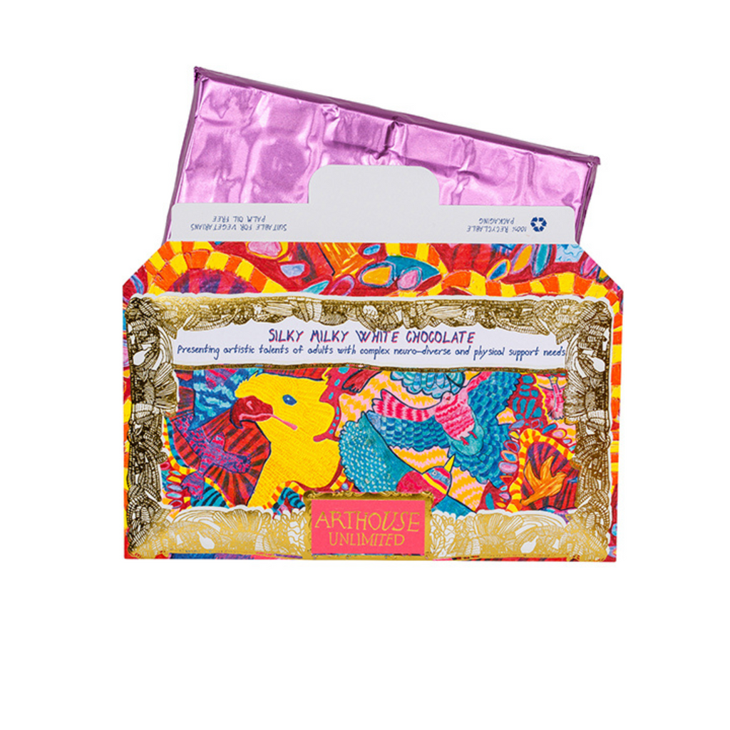 Silky Milky White Chocolate bar in vibrant, colorful packaging featuring artwork and the "Arthouse Unlimited" logo.
