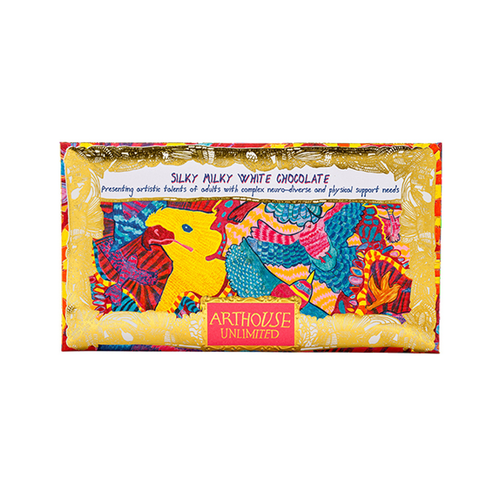Silky Milky White Chocolate bar with vibrant, colorful artwork featuring birds and animals; gold-accented wrapper.