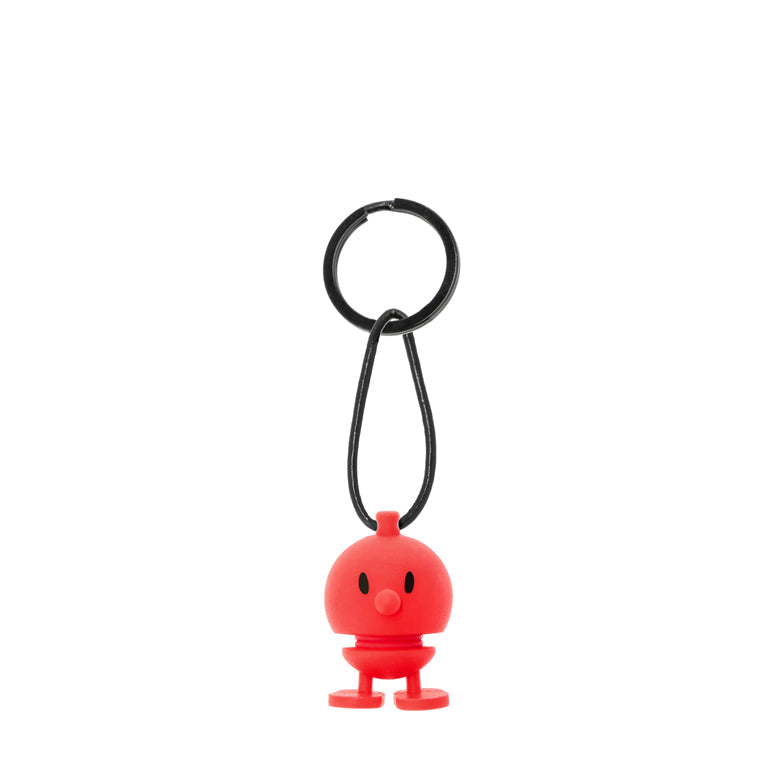 Red rubber Mr. Men keyring with black cord and ring.  The figure has a simple face and small legs.