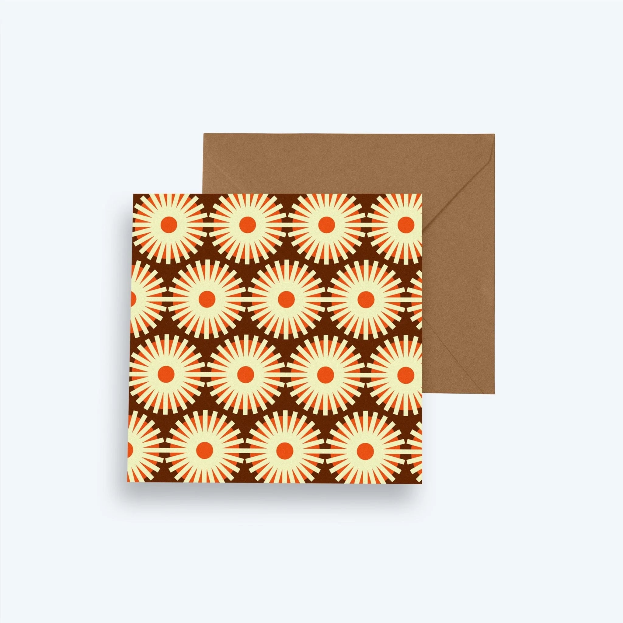 Greeting card with sunflower pattern and brown envelope on a white background
