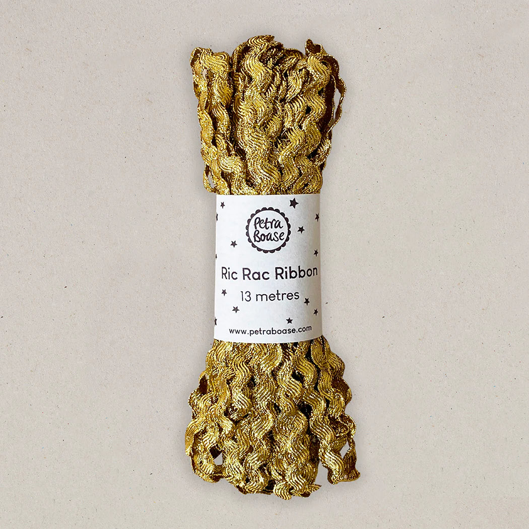 Gold metallic Ric Rac ribbon, 13 meters, rolled and packaged. The ribbon has a wavy, textured pattern.