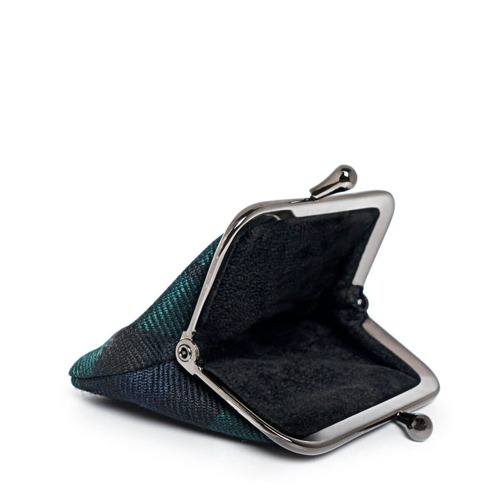 Open dark green and black plaid coin purse with a gunmetal frame.