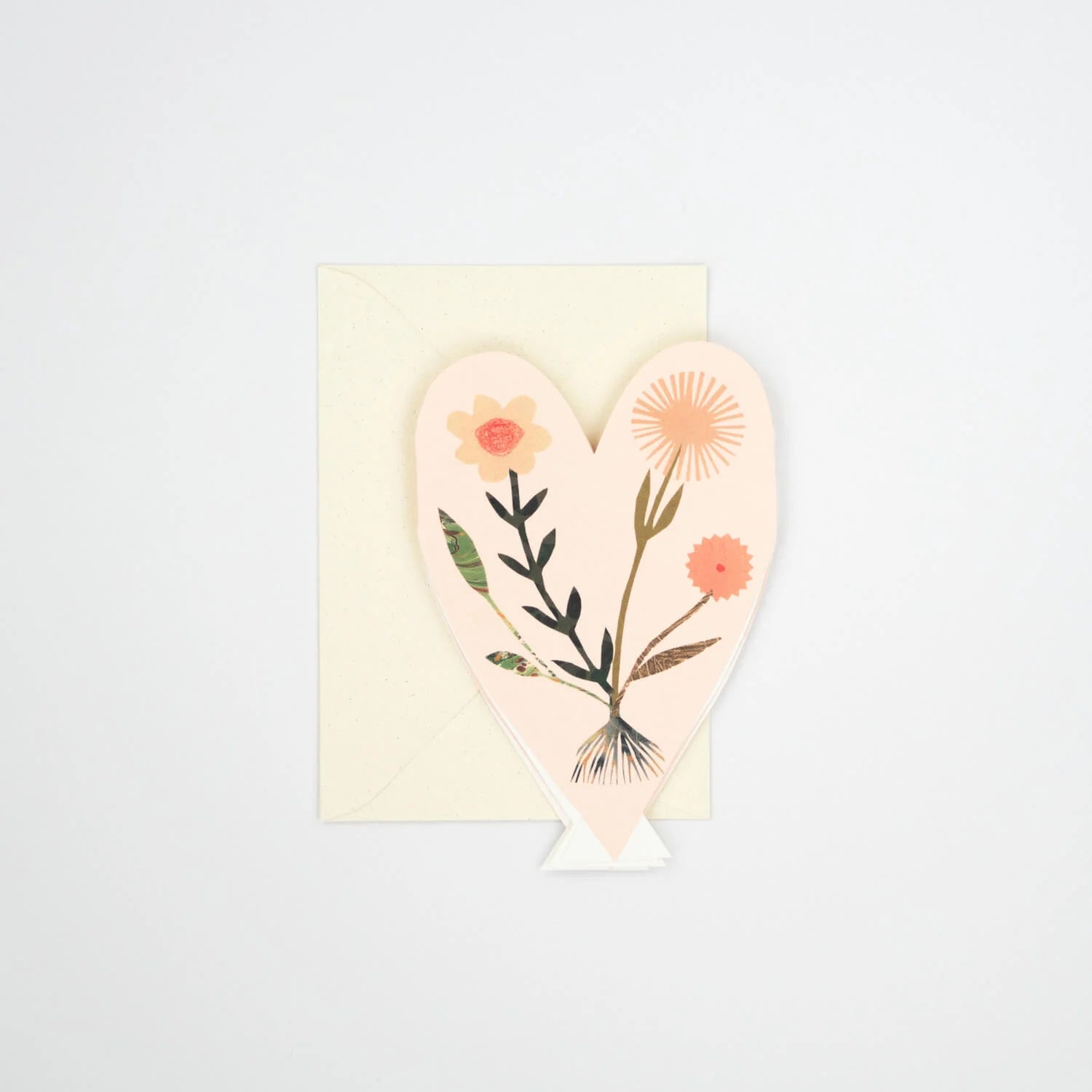 Pink heart-shaped greeting card with layered floral design.