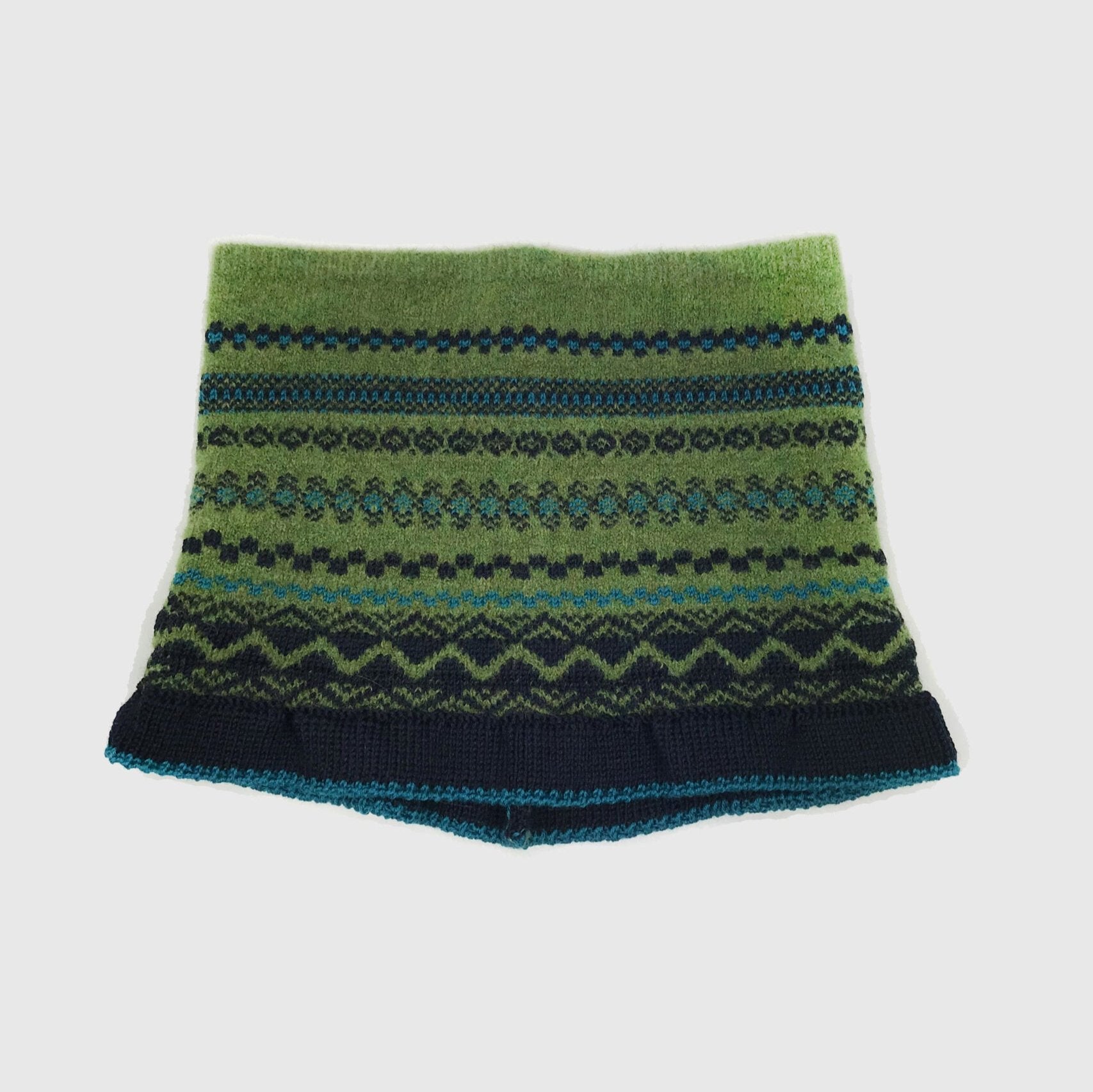 Green and black wool knit neck warmer with a Fair Isle-style pattern.  The bottom band is dark blue.