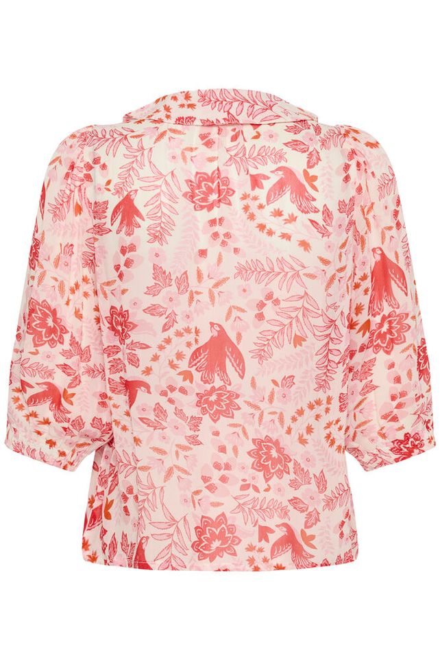 Floral patterned blouse with red and pink design on a white background