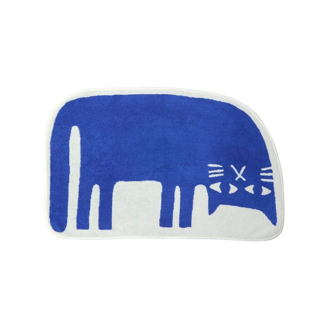 Blue and white elephant-shaped bath mat on a white background