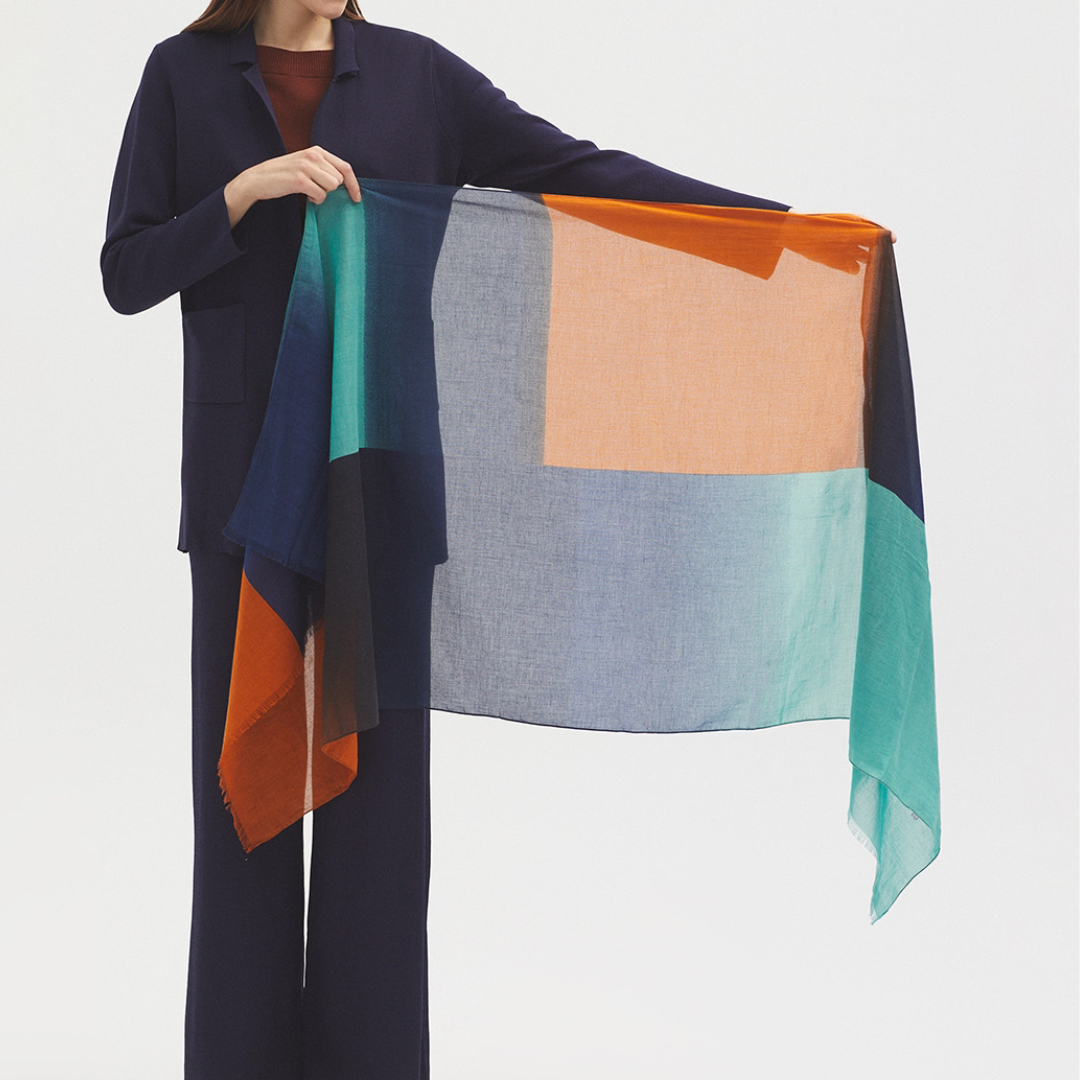 Large, rectangular color-block scarf in teal, navy, and burnt orange.