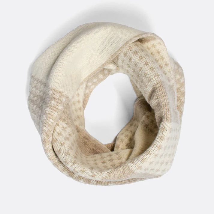 Cream and beige knitted infinity scarf with a subtle patterned design.