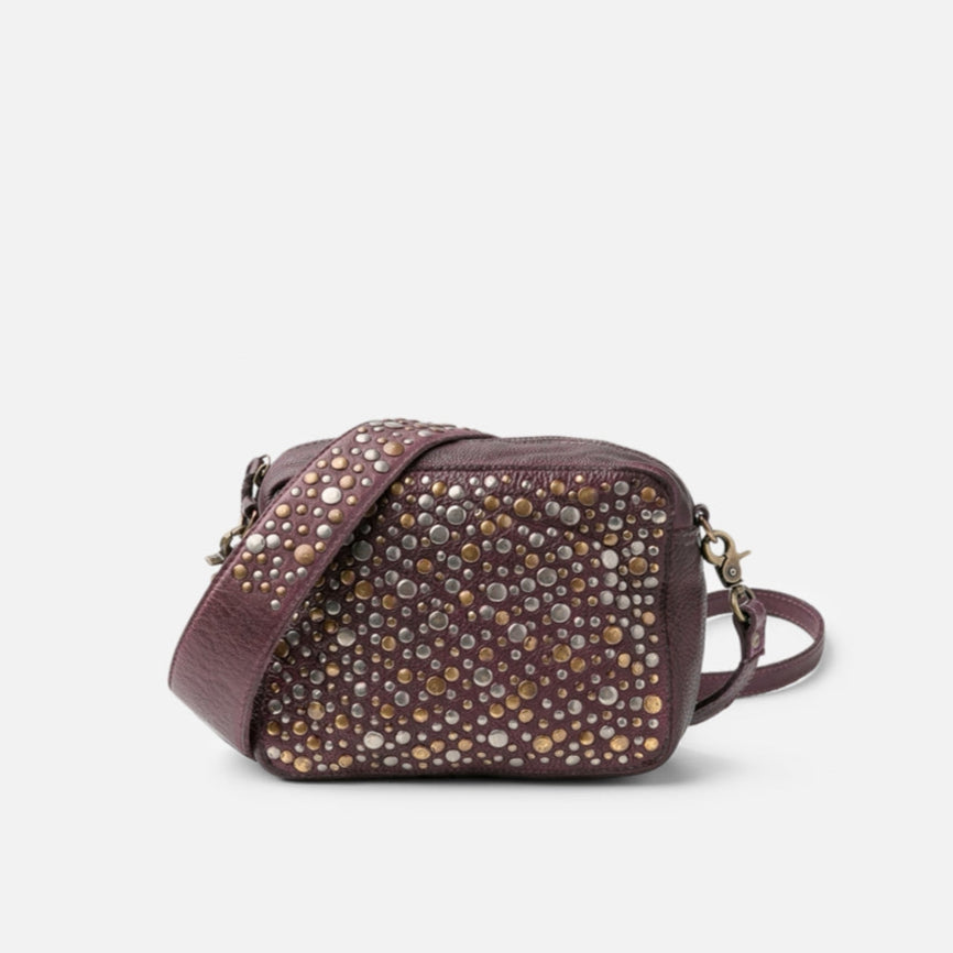 Purple studded handbag on a white background
