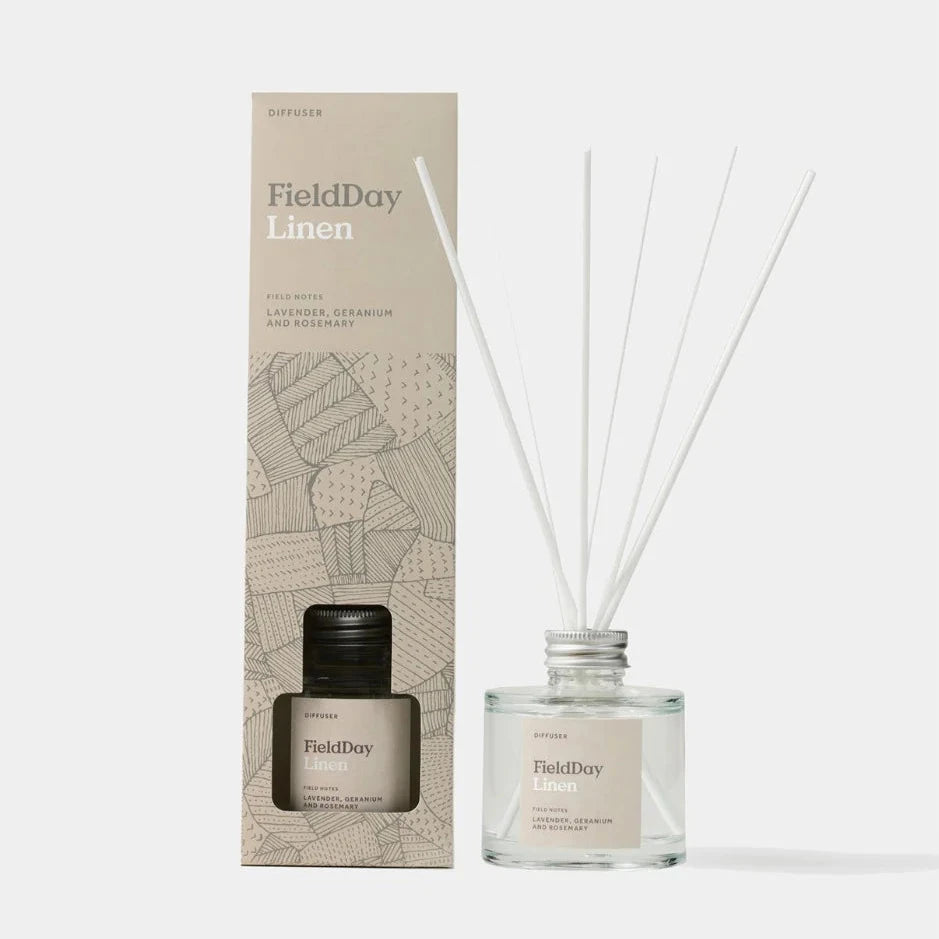 FieldDay Linen reed diffuser with lavender, geranium, and rosemary scent.