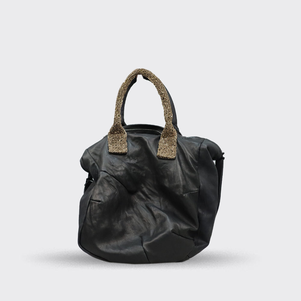 Black leather handbag with textured surface and beige knitted handles.