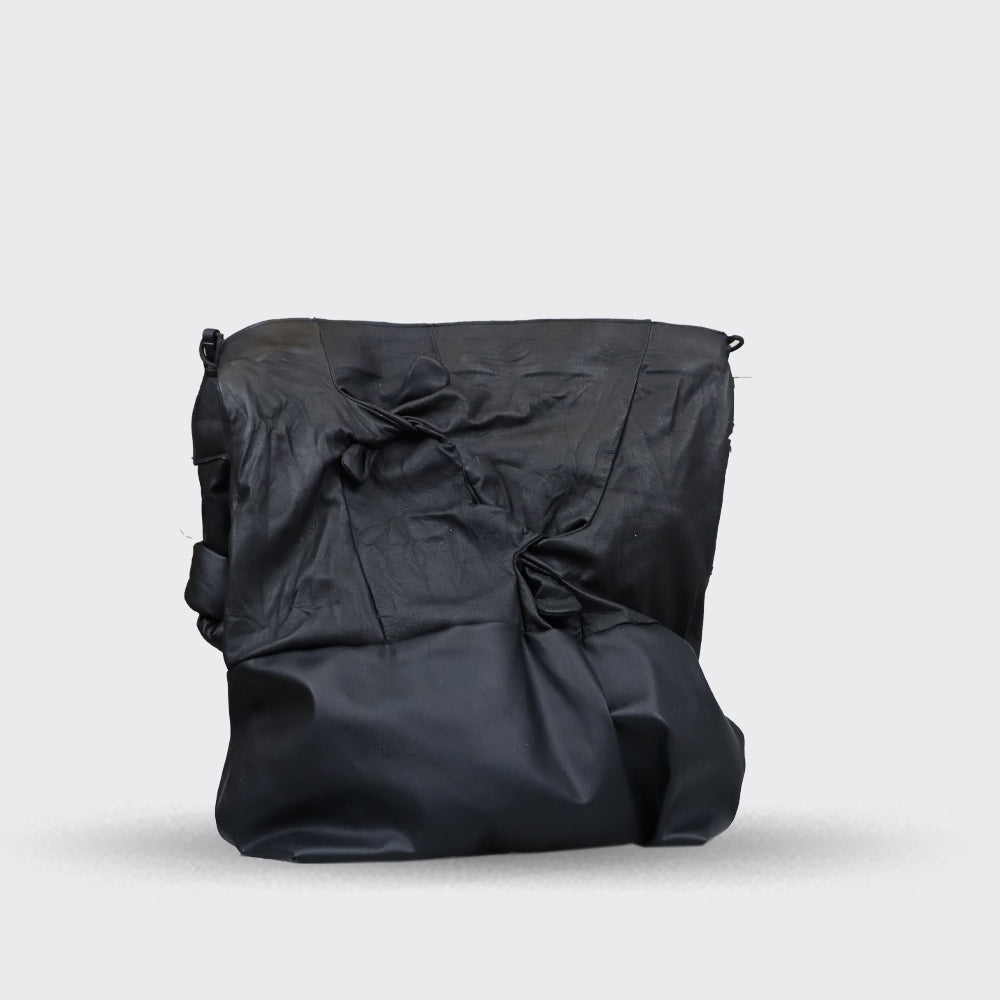 Black leather shoulder bag with gathered detailing and a slightly slouched shape.