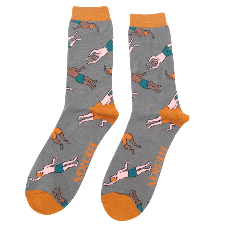 Pair of gray crew socks featuring a repeating pattern of illustrated swimmers in orange swim trunks.