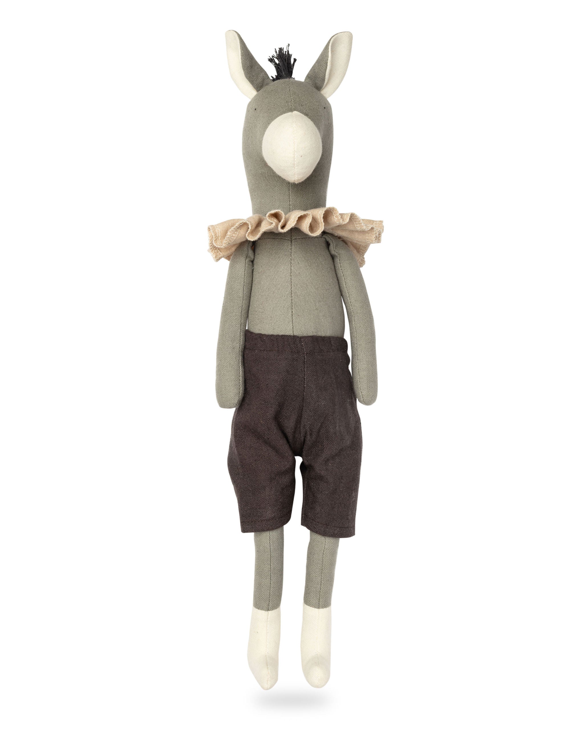 Stuffed toy donkey wearing a sweater and shorts on a white background