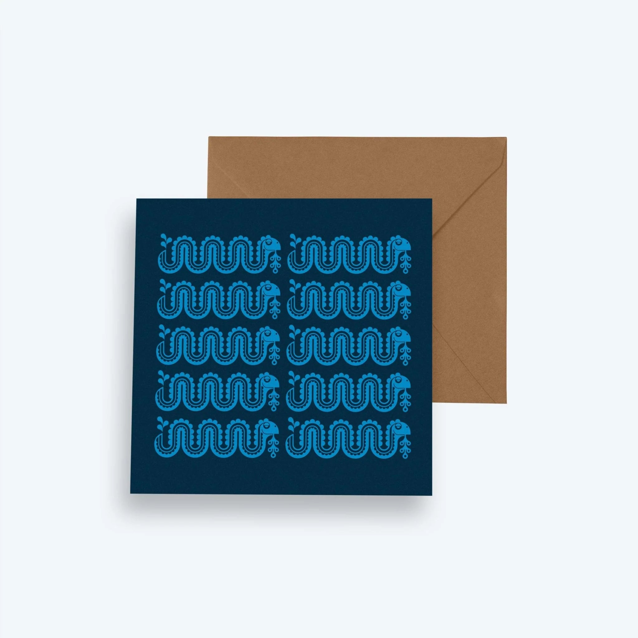 Navy blue card with wavy line pattern and brown envelope on a light gray background