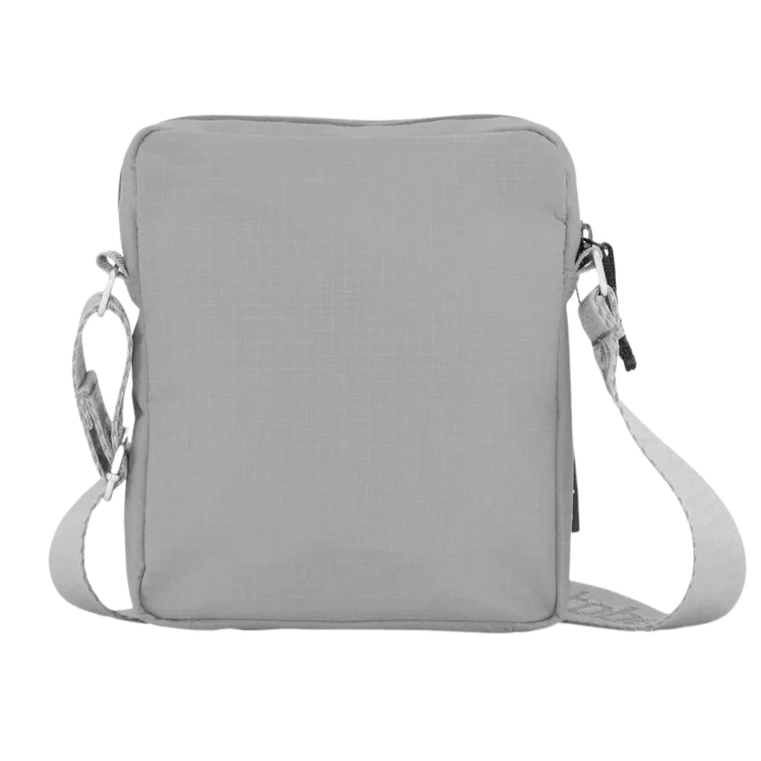 Light gray rectangular crossbody bag with a zipper closure and adjustable strap.