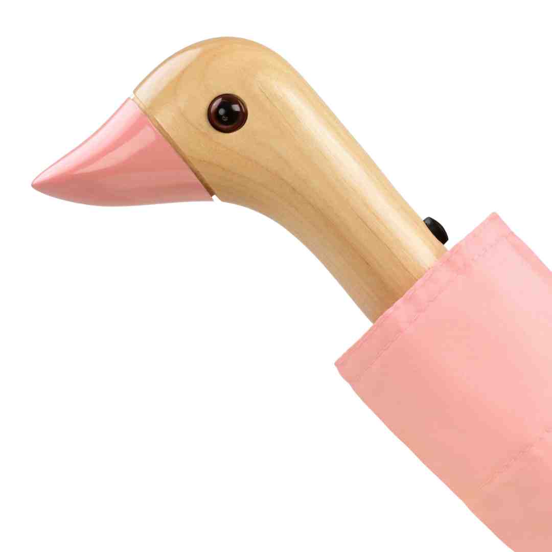 Pink and light wood goose-shaped umbrella handle.