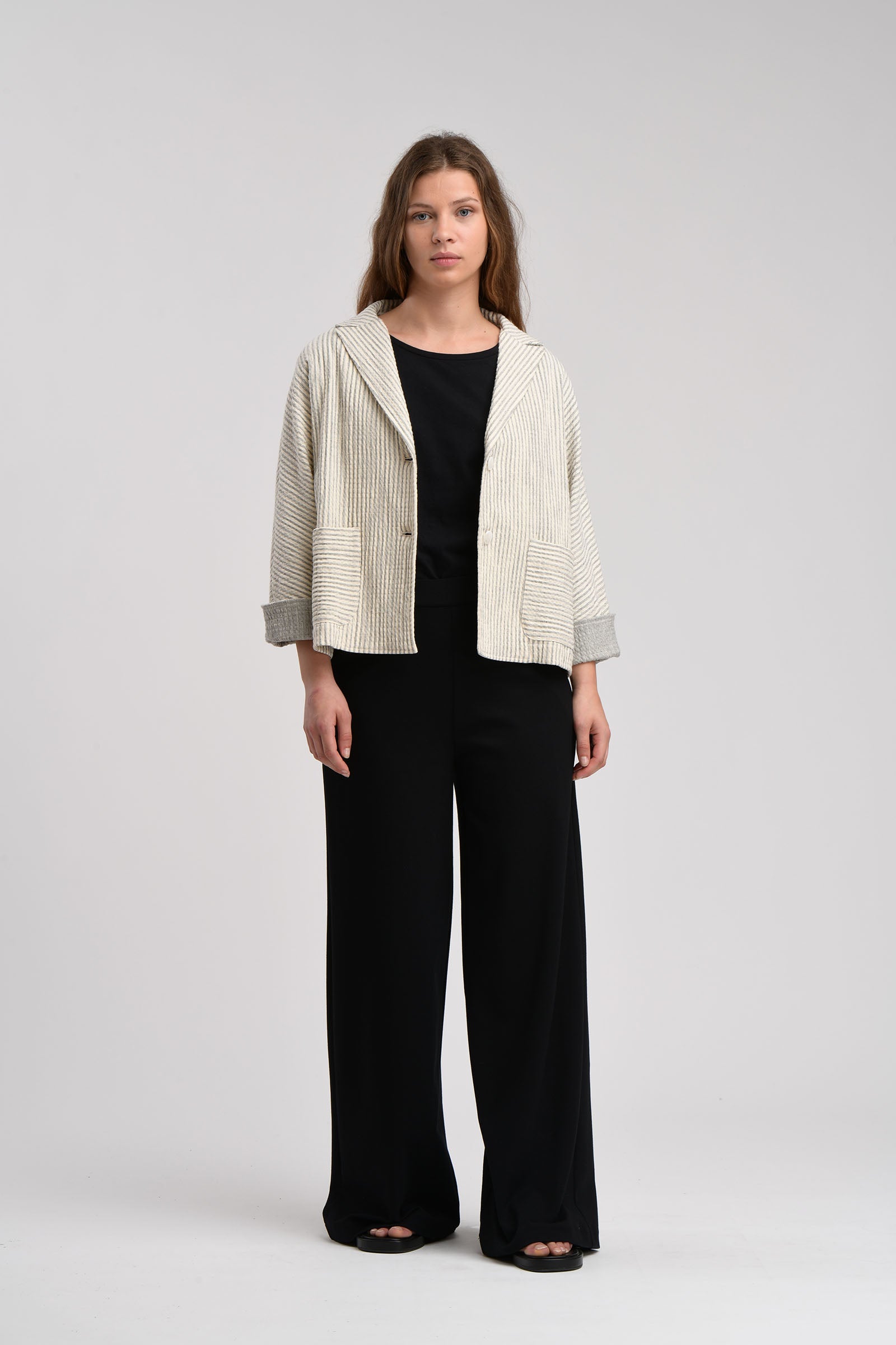 Off-white striped linen jacket with patch pockets and a notched collar.