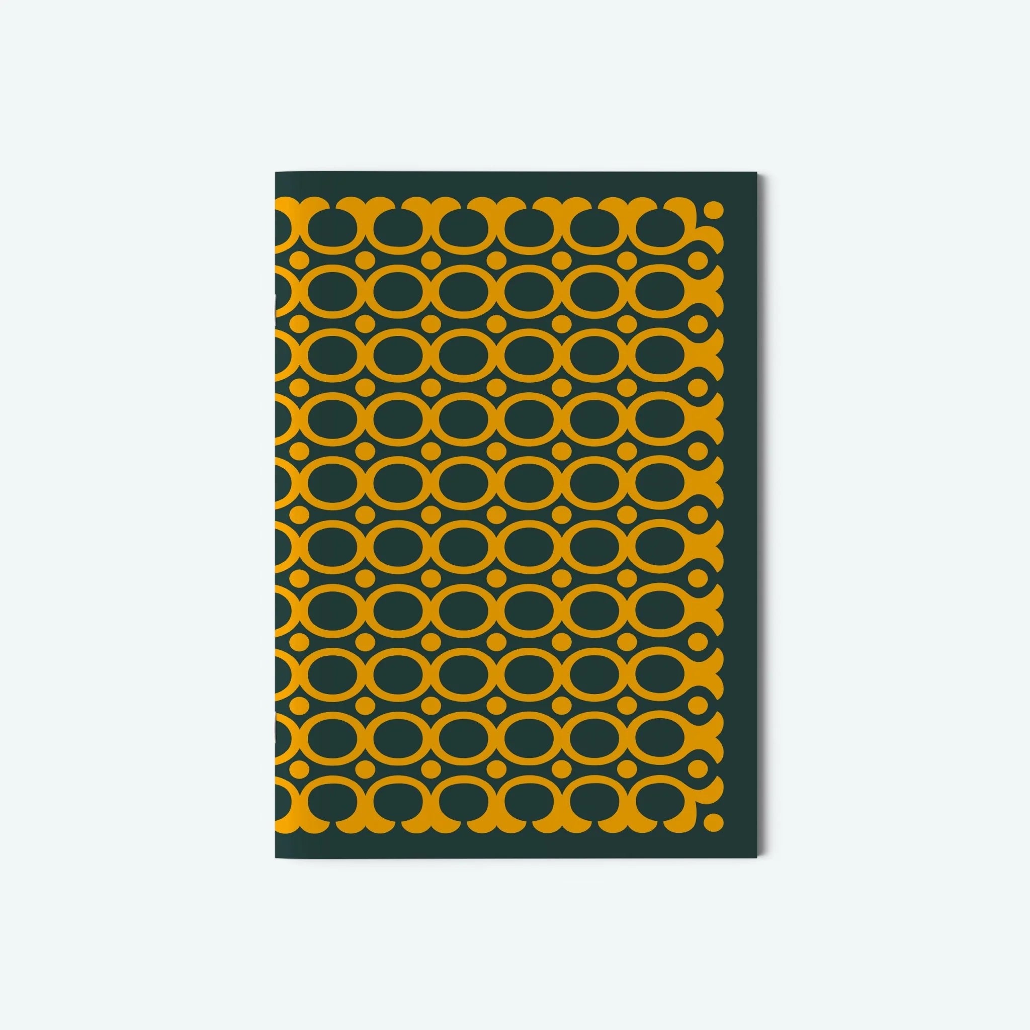 Notebook with green and yellow geometric pattern on a white background