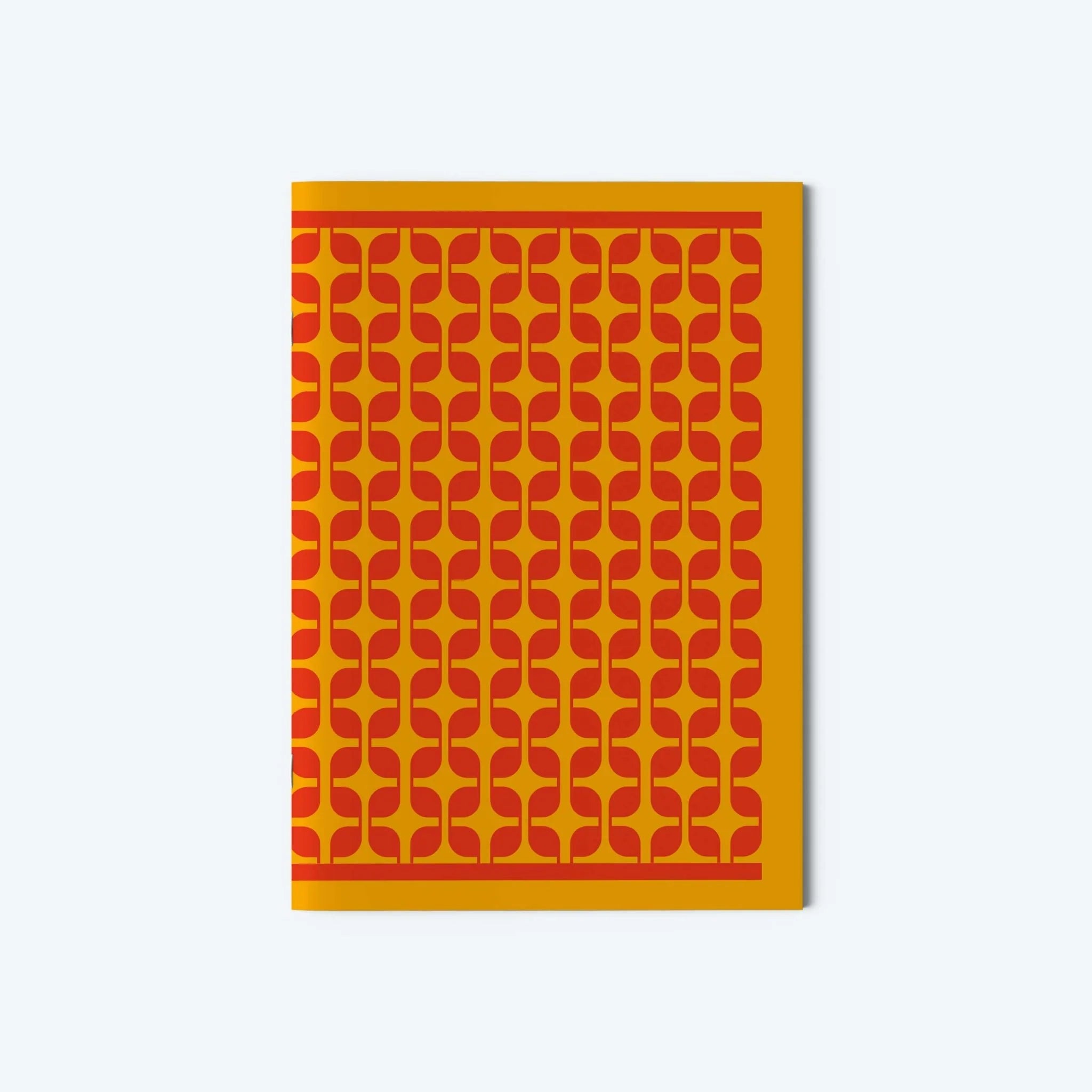 Notebook with a red geometric pattern on a yellow background