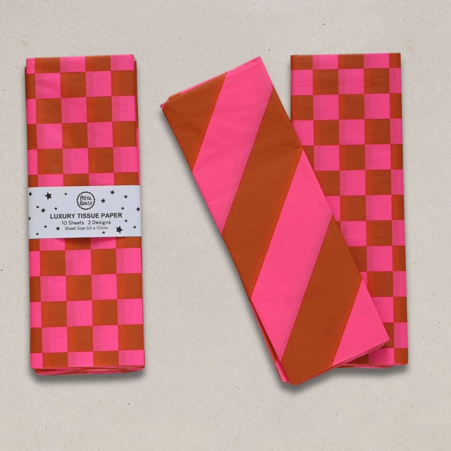 Ten sheets of luxury tissue paper in pink and orange; two designs: checkered and diagonal stripes.