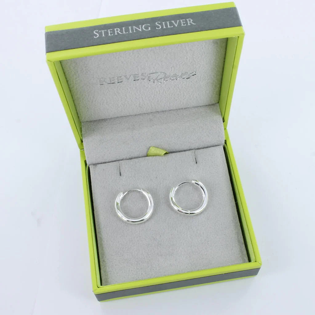 Sterling silver hoop earrings in a lime green gift box.