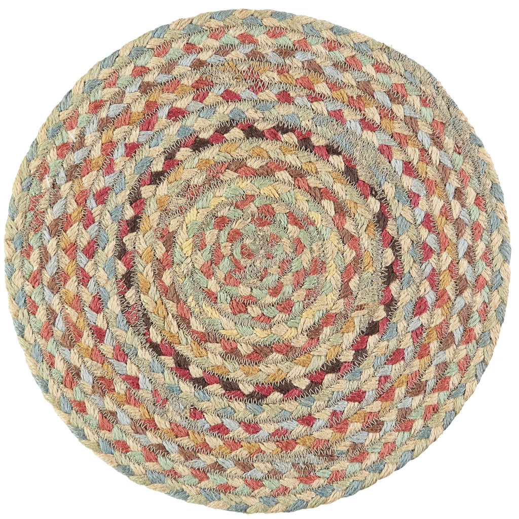 Round braided rug with concentric circles in muted earth tones, including beige, brown, red, and blue.