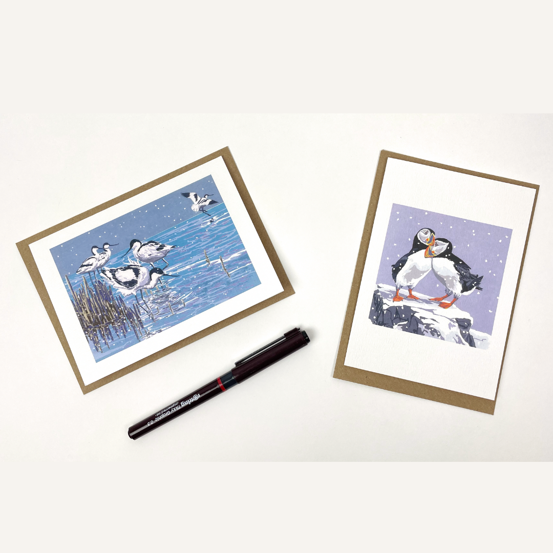 Two illustrated Christmas cards. One depicts avocets in a snowy wetland scene.