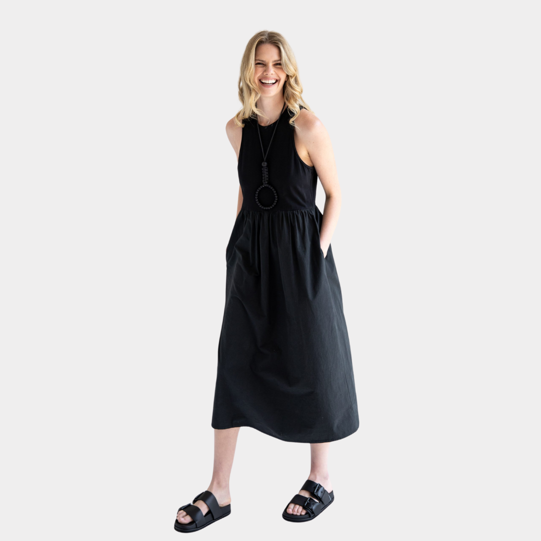 Black midi dress with a gathered waist and pockets.