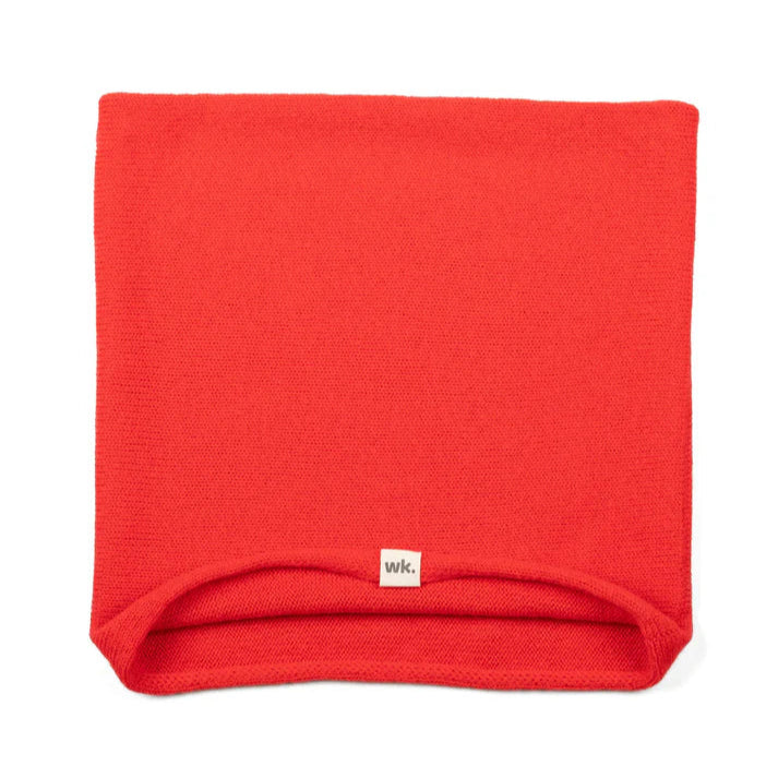 Bright red knitted neck warmer.