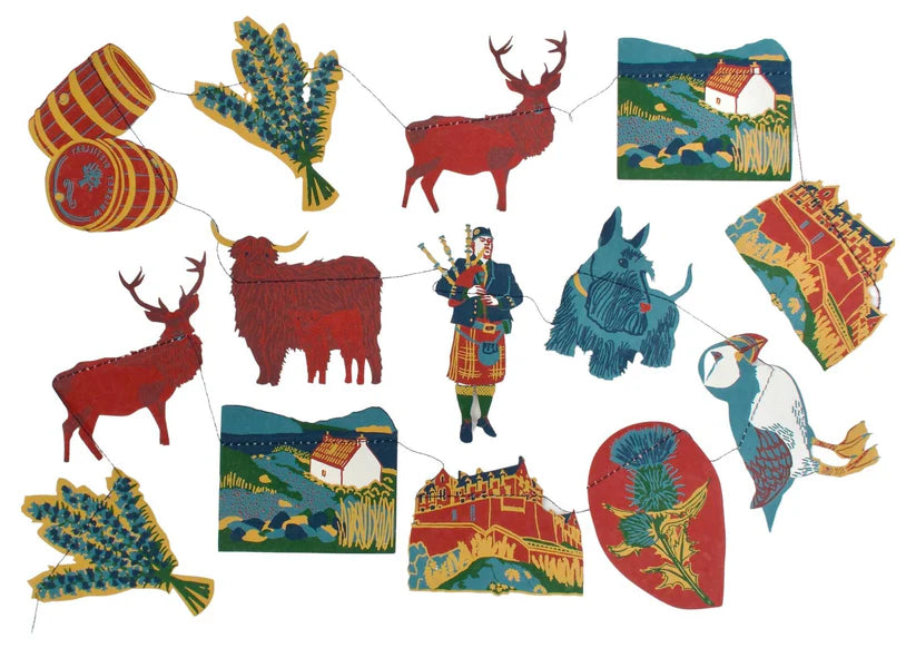 Scottish-themed paper garland featuring Highland cattle, deer, a piper, a Scottie dog, puffins, lavender, whisky barrels,