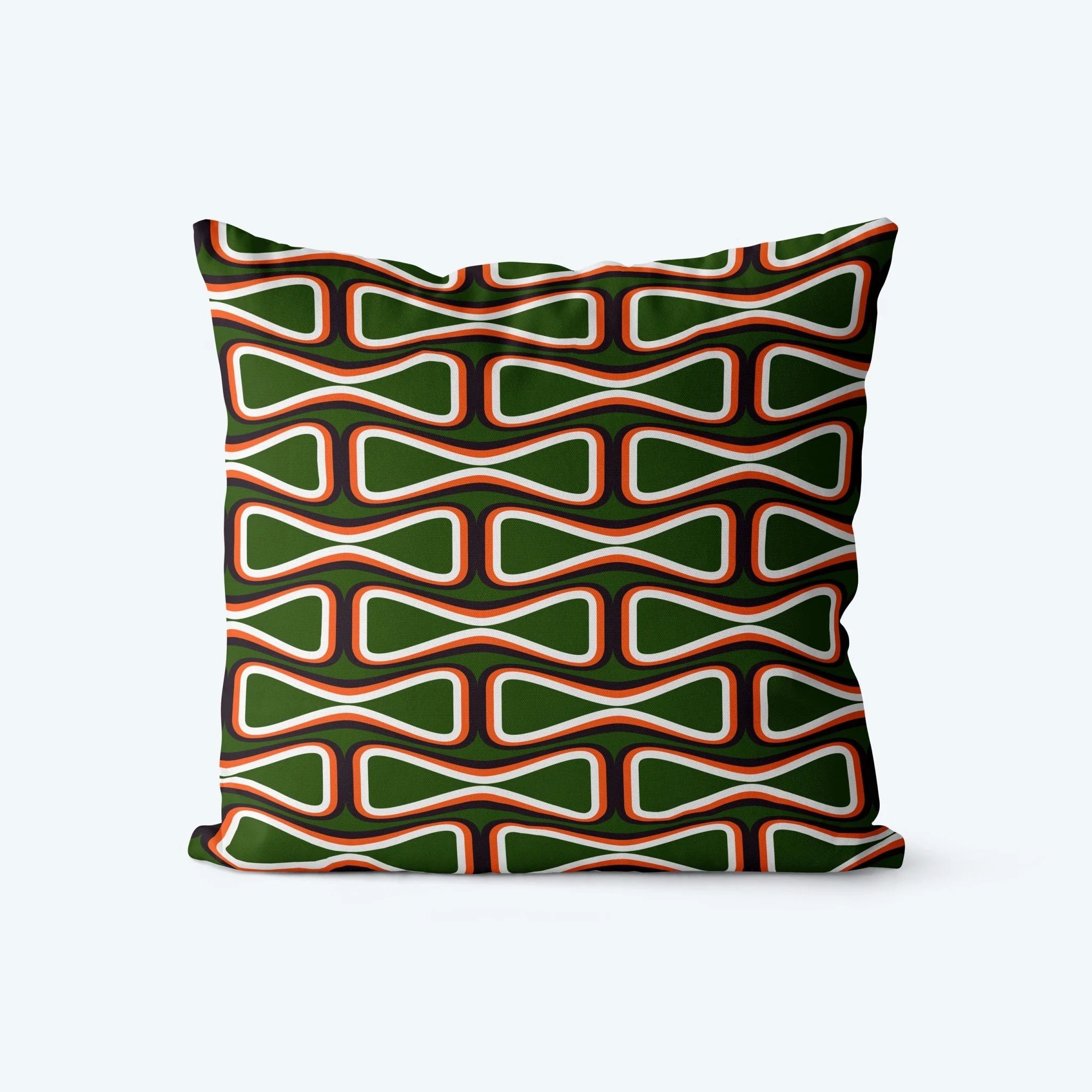 Decorative pillow with a green and orange geometric pattern on a white background