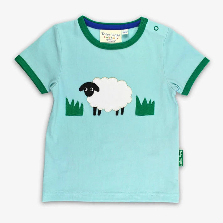 Light blue t-shirt with a sheep design on a white background