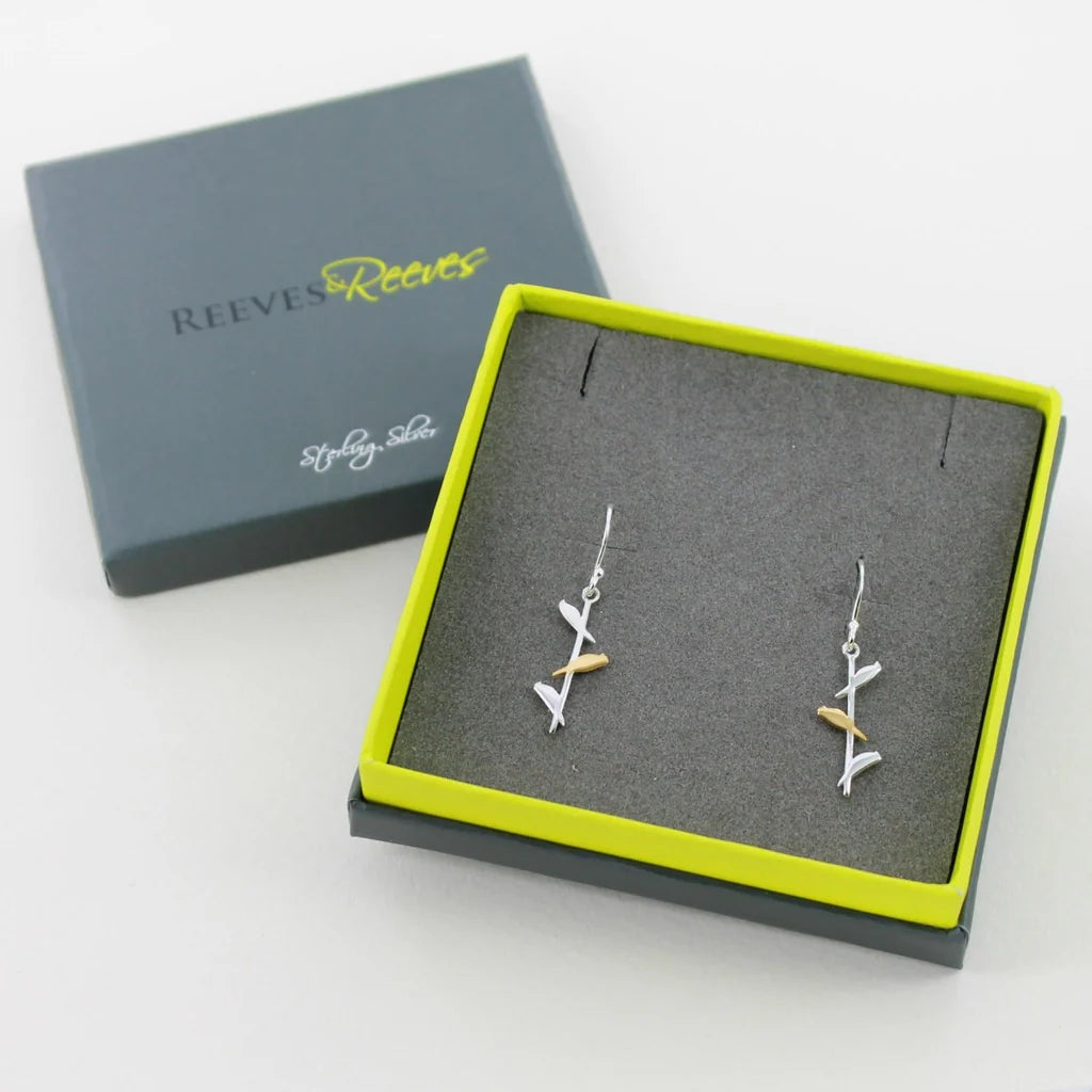 Sterling silver and gold earrings; stylized branch design with small bird accents.  Presented in a gray gift box.