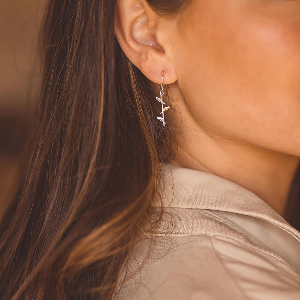 Silver leaf-shaped dangle earrings.