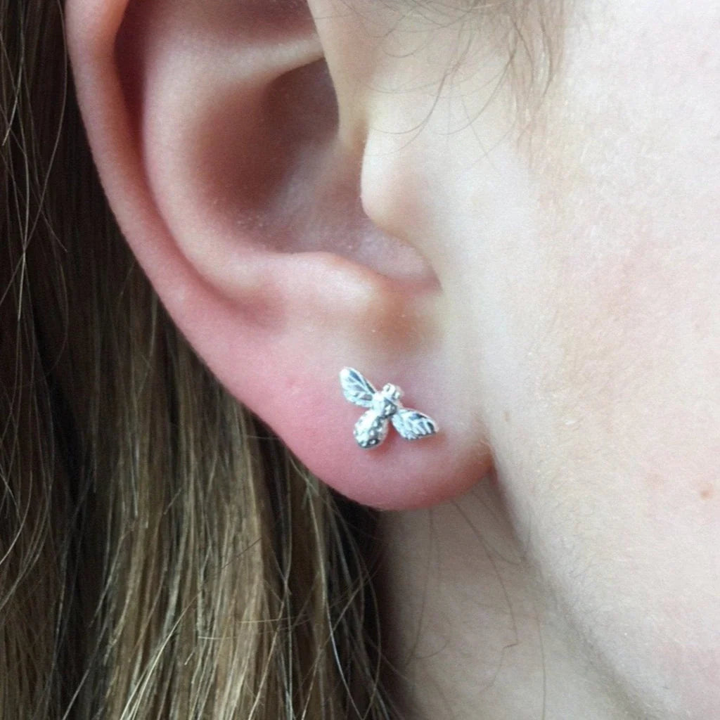Silver bee stud earrings.  Small, detailed bee design.
