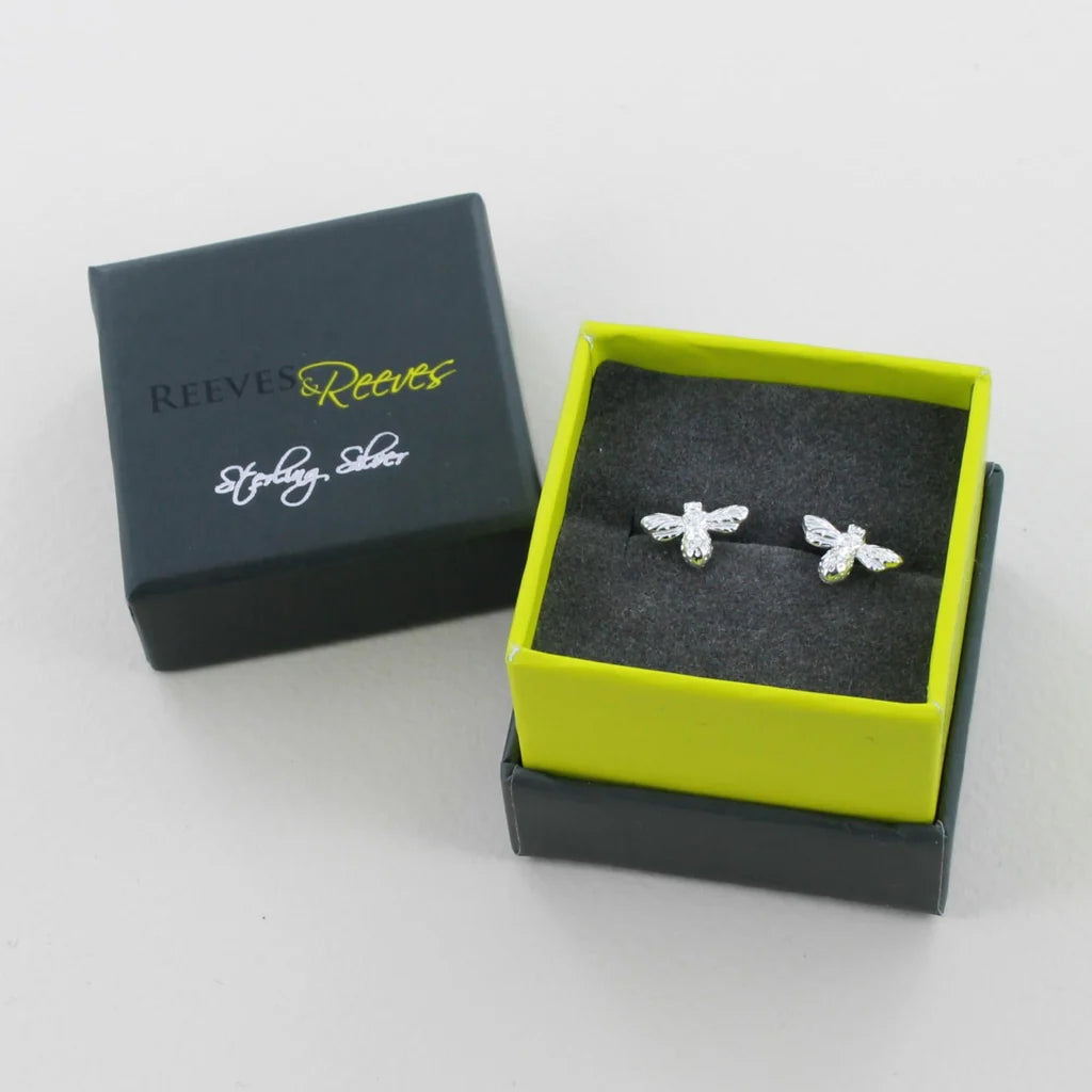 Sterling silver bee stud earrings in a lime green and dark gray gift box.