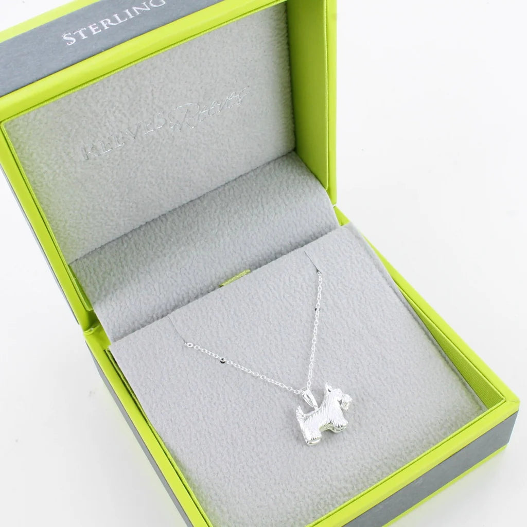 Sterling silver necklace in a lime green box.  The pendant is a textured Scottish Terrier.