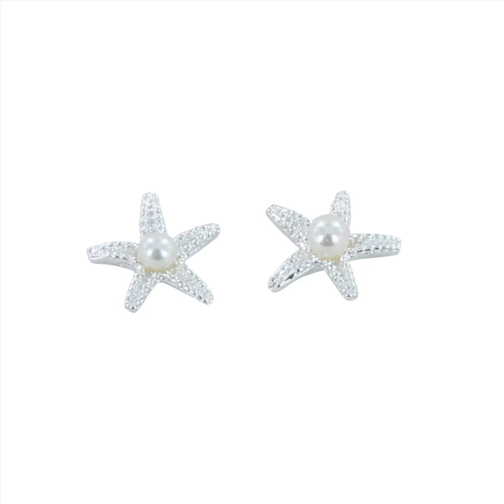 Pair of silver starfish stud earrings, each adorned with a central pearl.