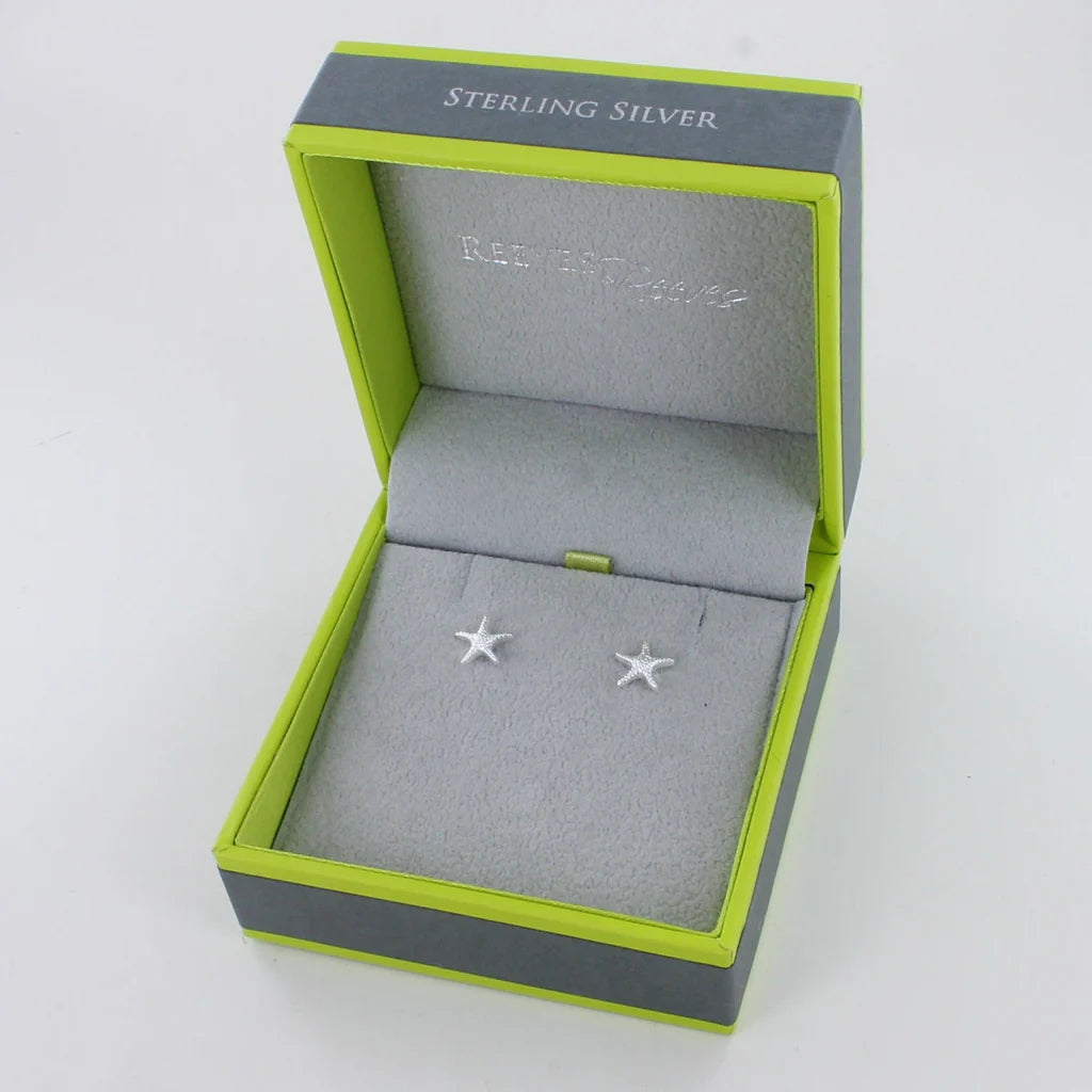 Sterling silver starfish stud earrings in a lime green and grey gift box.
