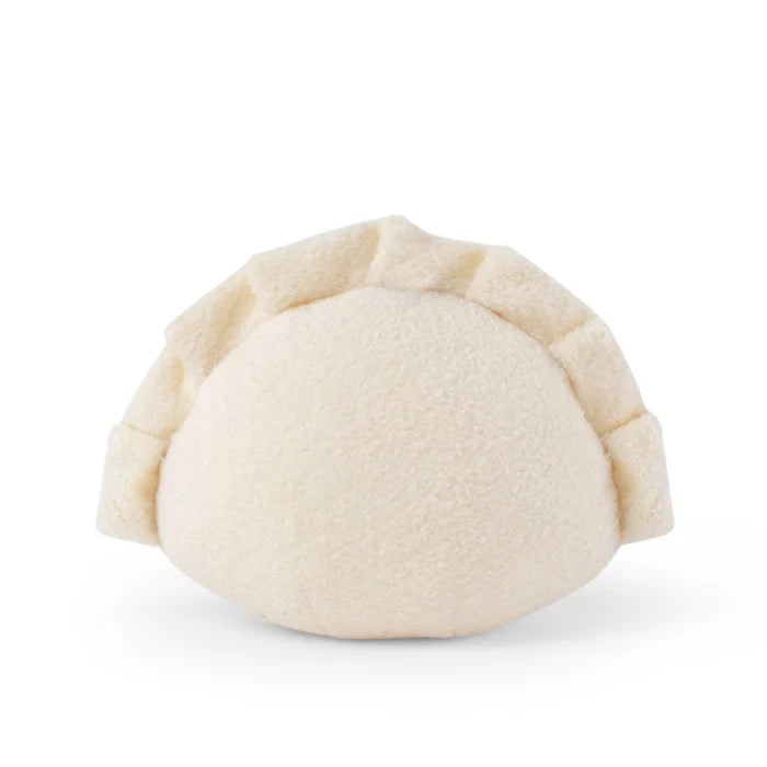 Cream-colored plush toy resembling a dumpling on a white background