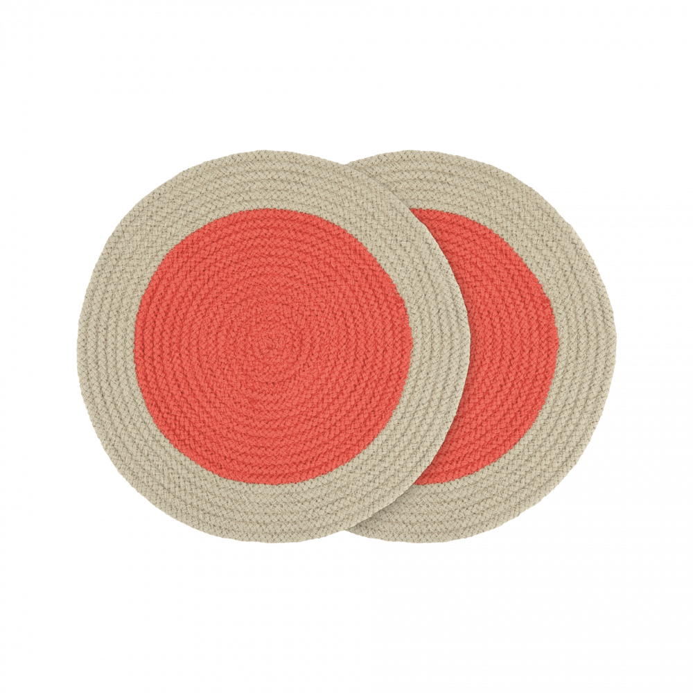 Two coral and beige round braided placemats.