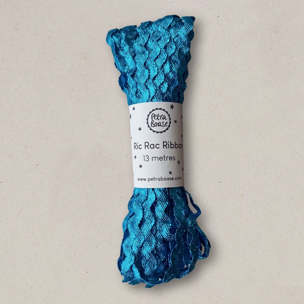 Teal blue Ric Rac ribbon, 13 meters, wavy texture.